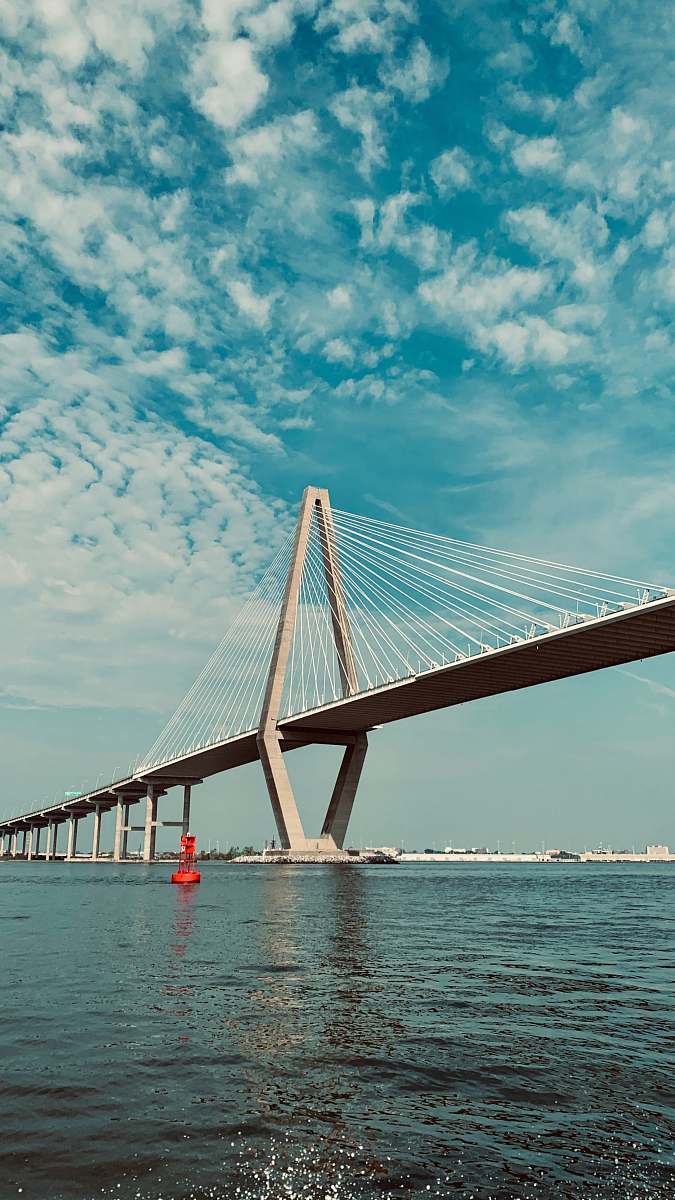bridge gray concrete bridge under white clouds suspension bridge