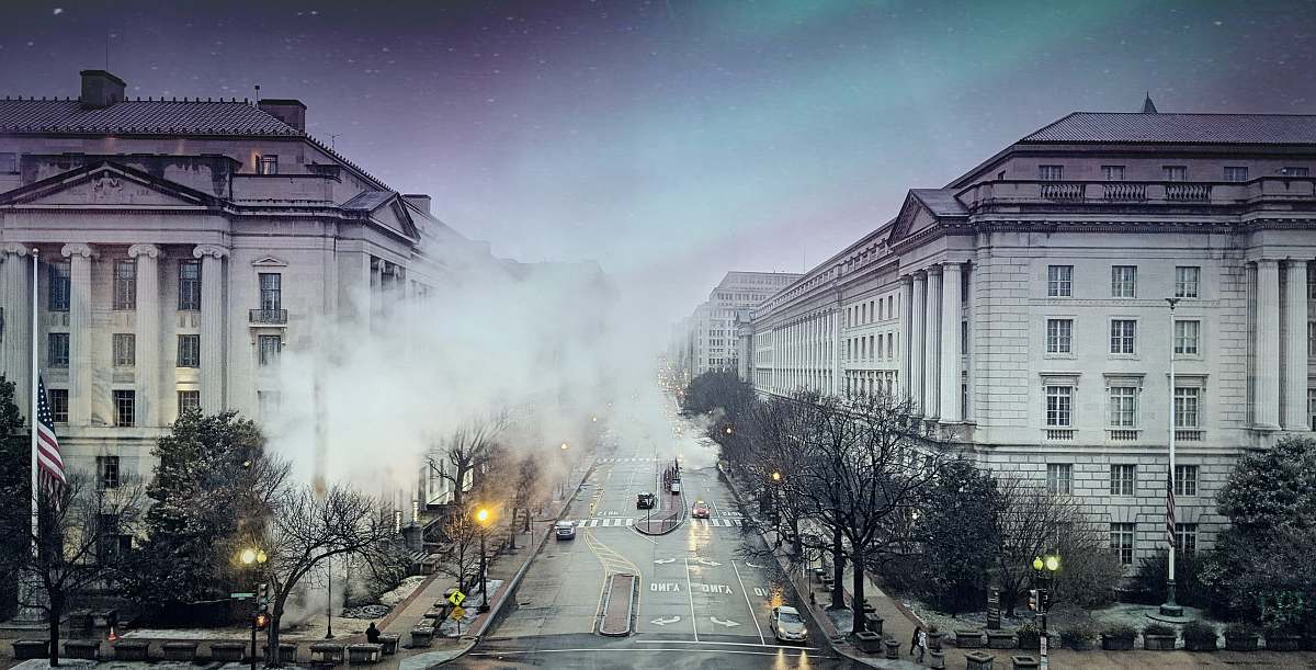 architecture gray concrete building covered with smoke street