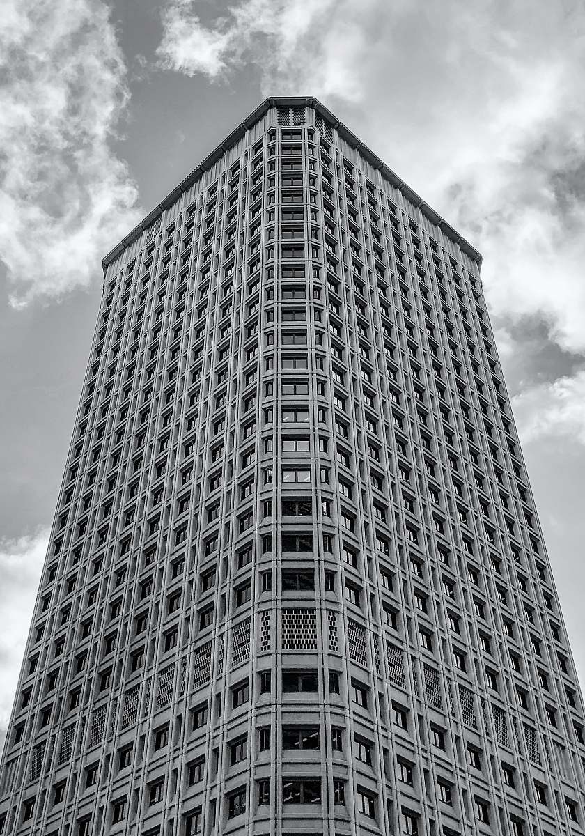 black-and-white grayscale photography of high-rise building office building