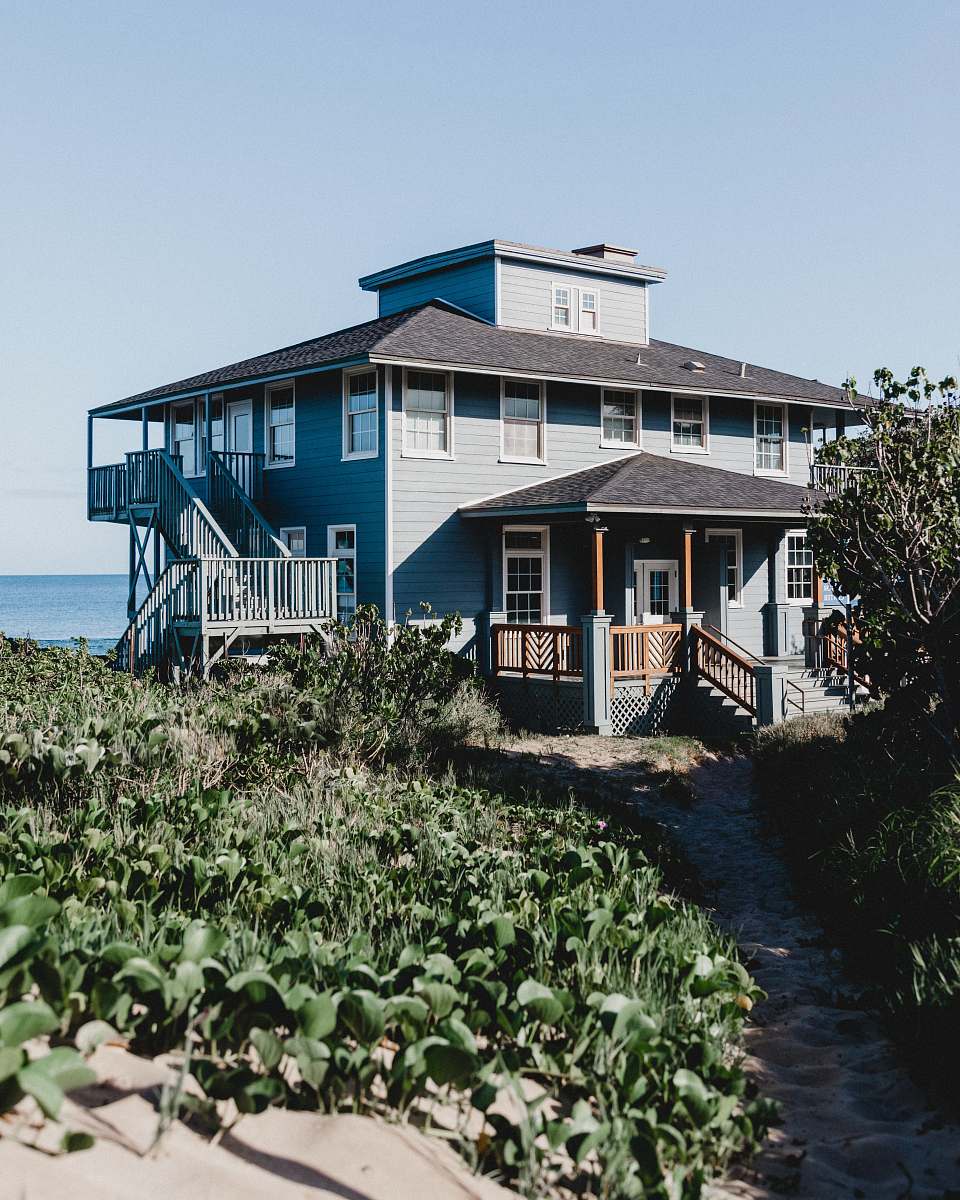 maui grey and brown wooden house during daytime outdoors