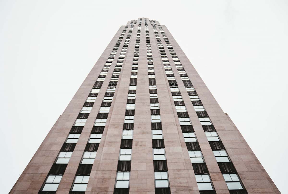 skyscraper high-angle photography of brown high rise building during daytime architecture