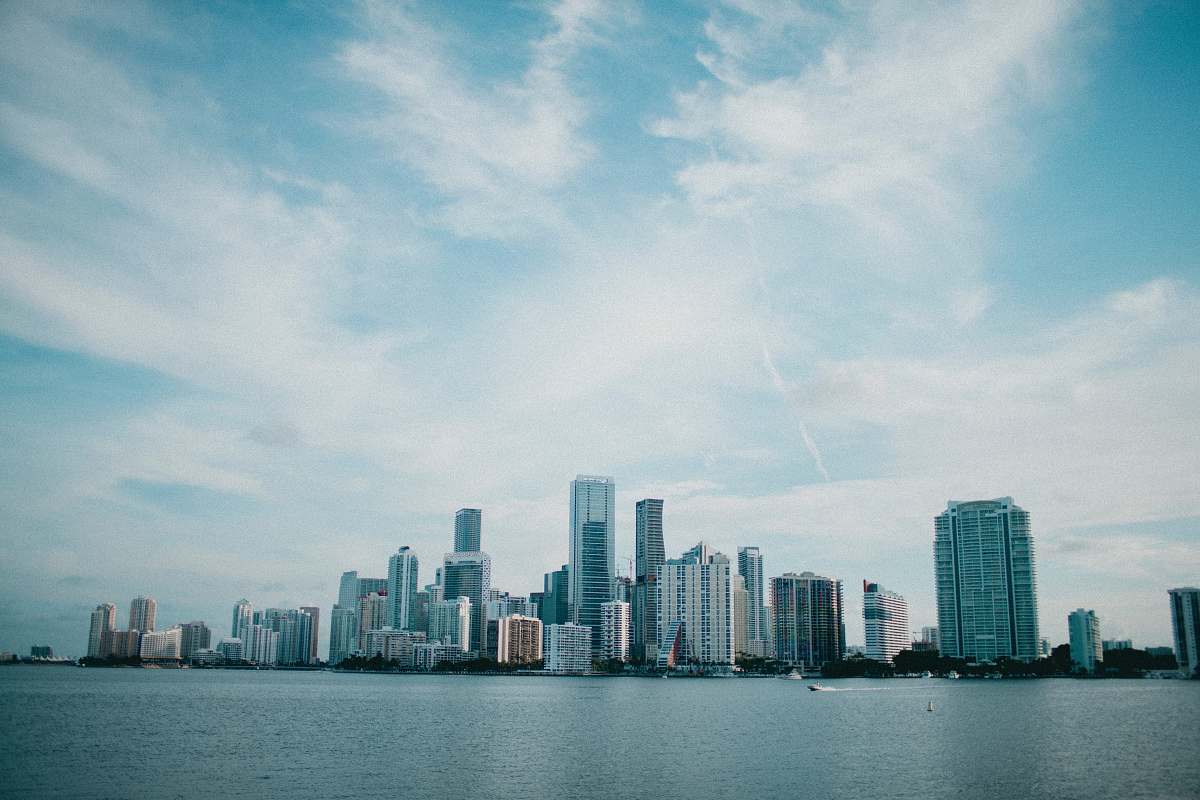 city landscape photography of city beside body of water high rise