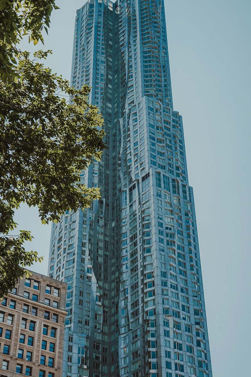 housing low angle photo of curtain glass wall building city