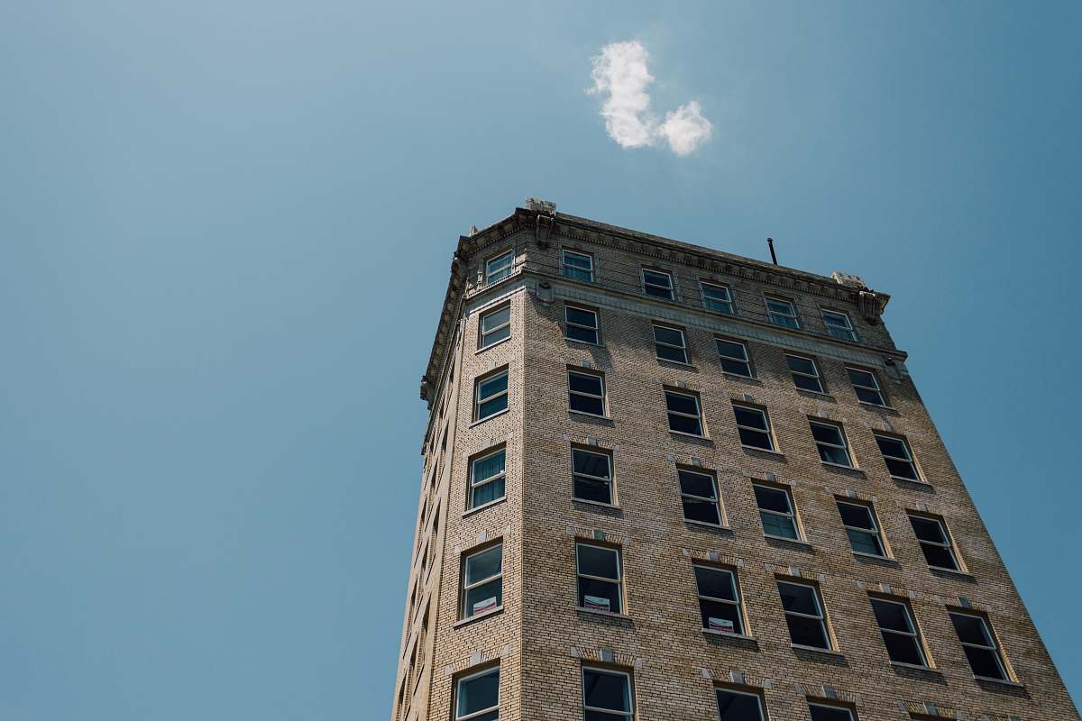 city low-angle photography of gray concrete building high rise
