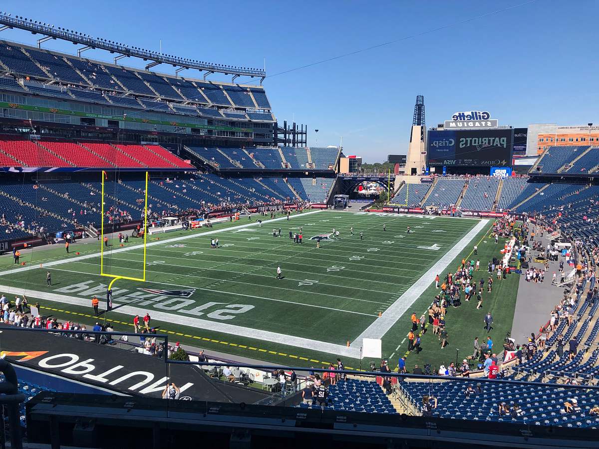 field people playing soccer on stadium during daytime arena
