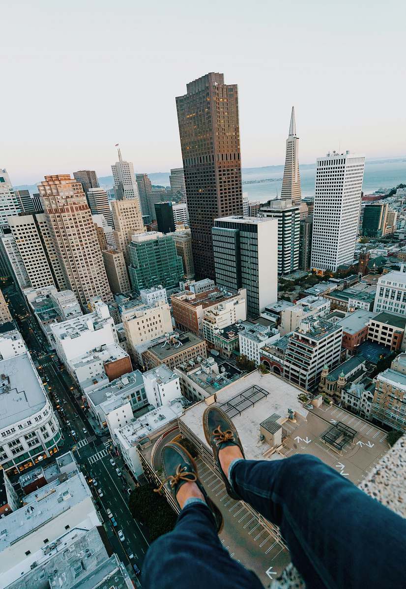 city person sitting on rooftop of building san francisco