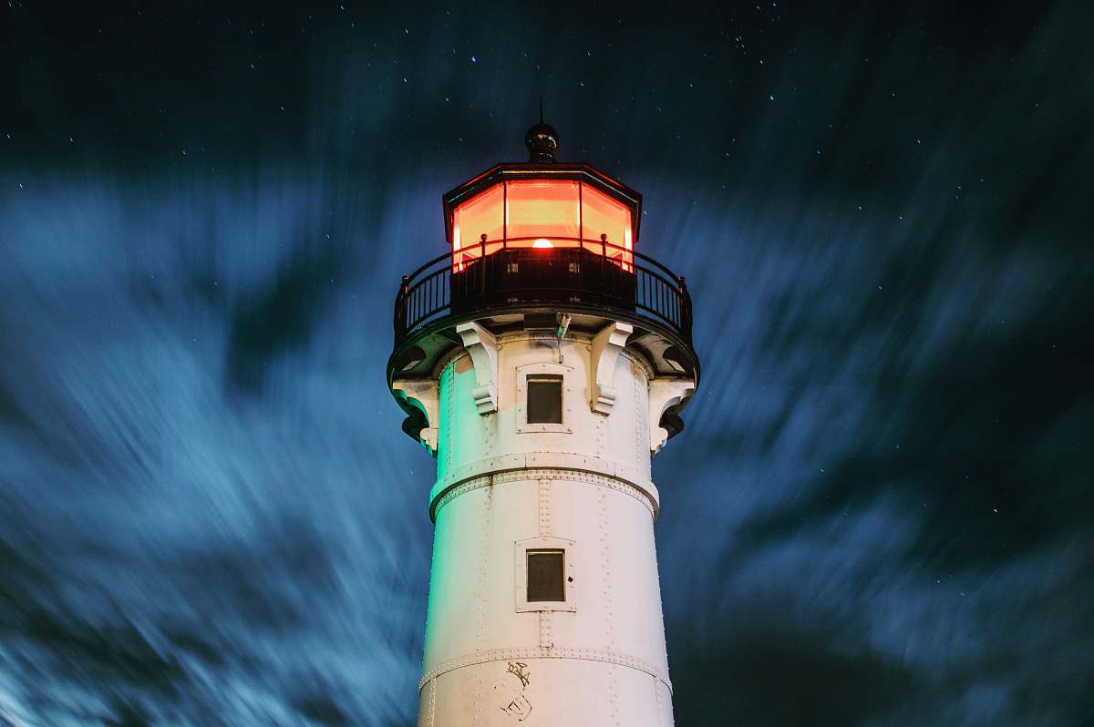 architecture selective focus photography of white and black lighthouse tower