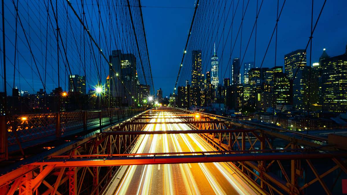 bridge timelapse photo of red bridge brooklyn bridge