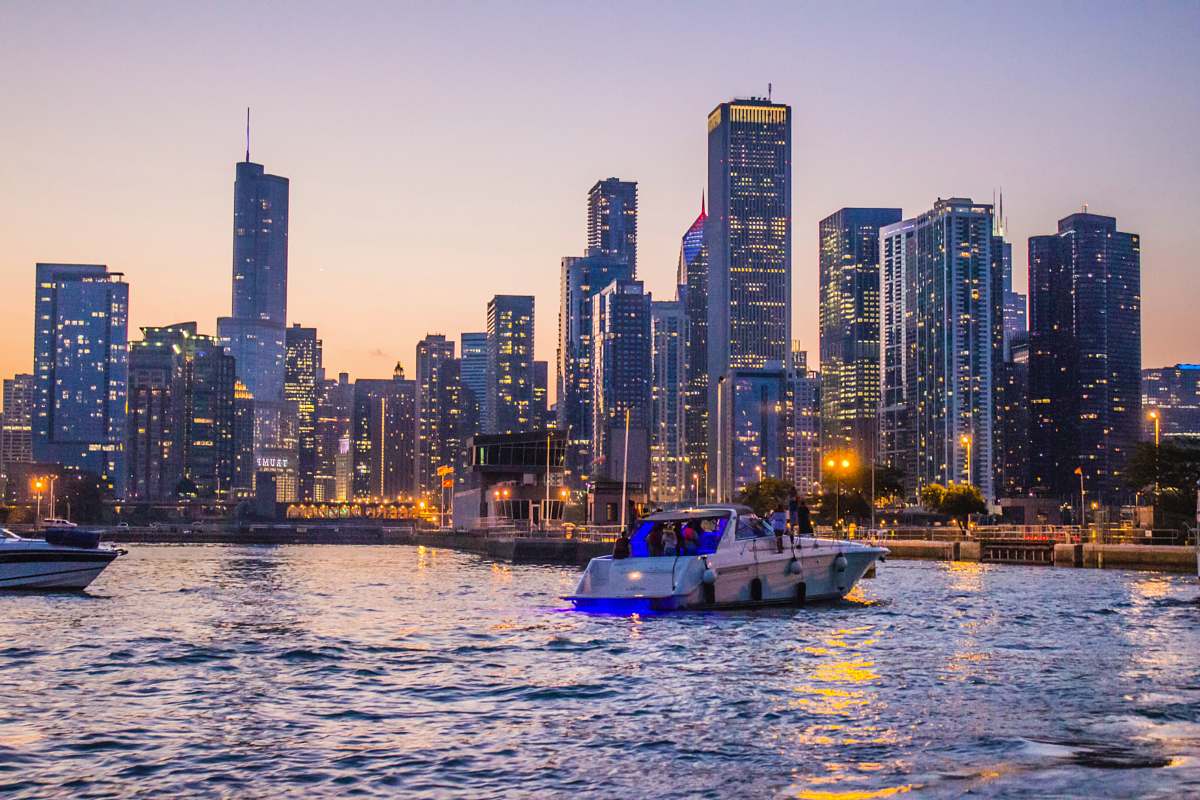 city white and blue yacht on body of water during daytime town