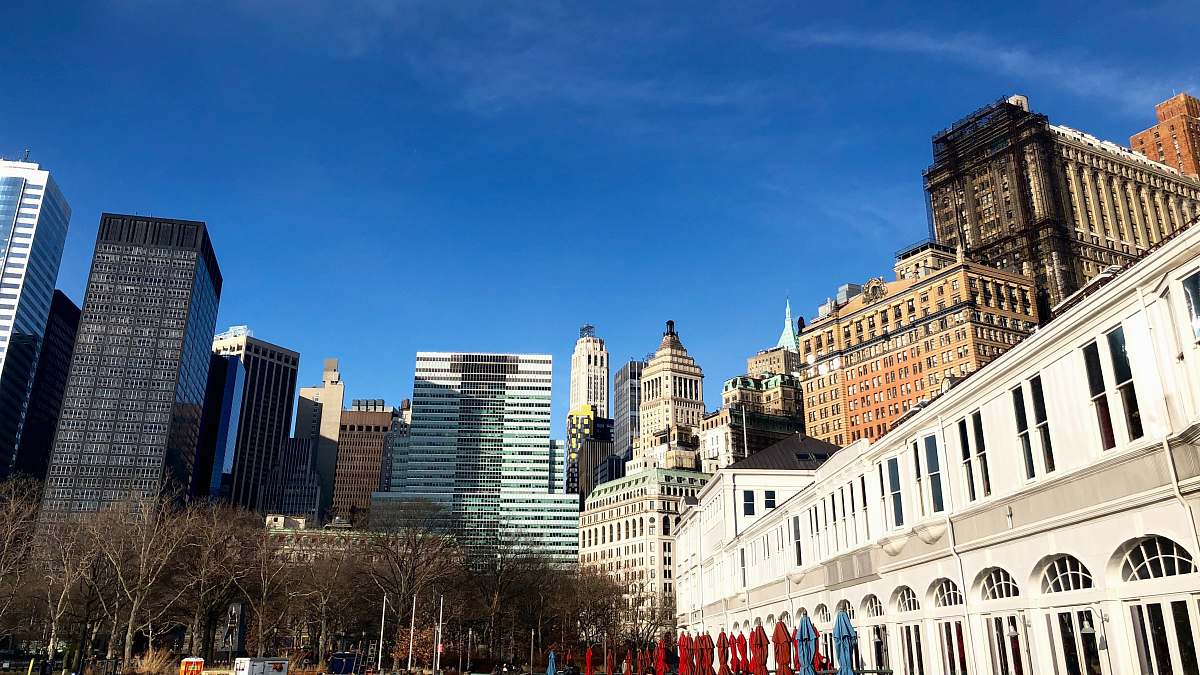 city white and brown concrete building under blue sky during daytime downtown