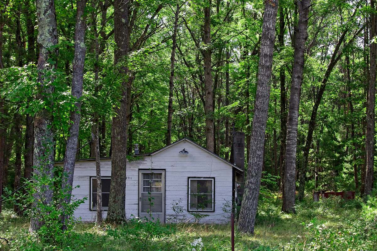 countryside white cabin in forest hut