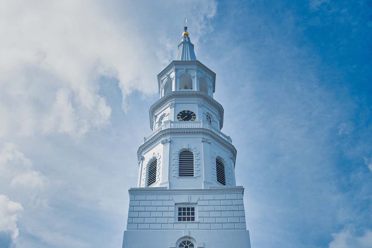 architecture white concrete clock tower during daytime tower