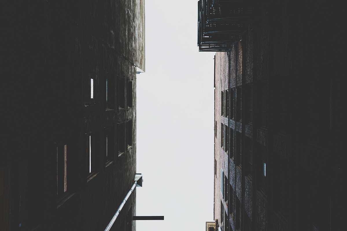 city worm's eye view of two high rise buildings grey