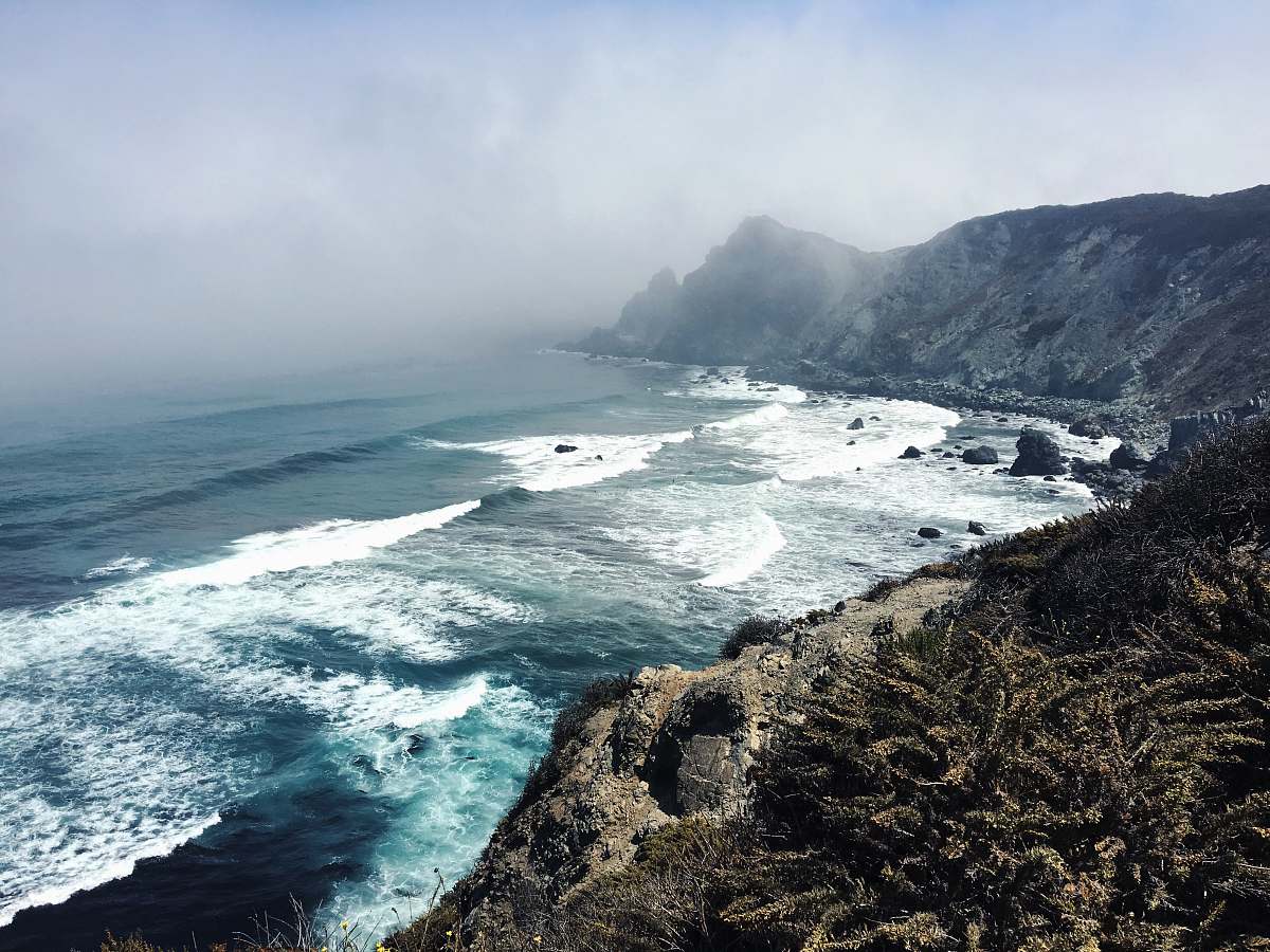 coast aerial view photography of body of water ocean