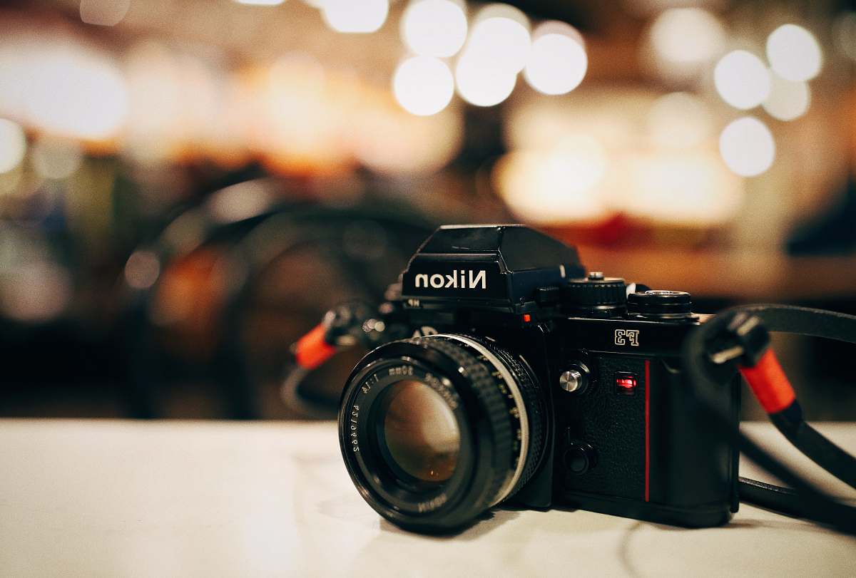 nikon selective focus photography of black Nikon MILC-camera boston