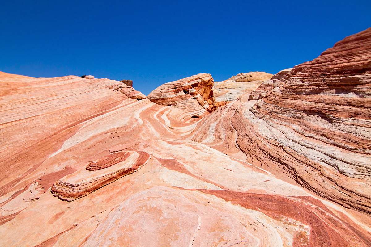 mountain low-angle photography of brown mountains under blue sky during daytime blue