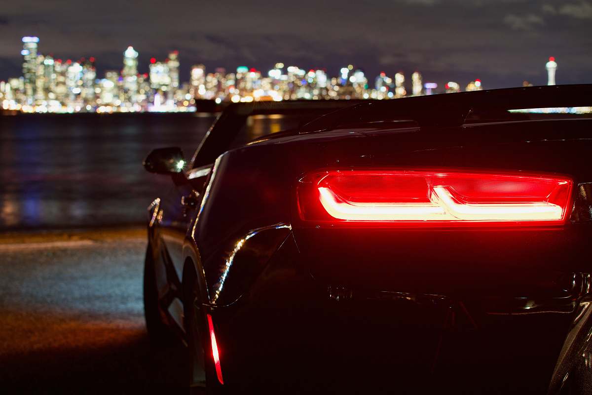 seattle black convertible coupe near shoreline scooter