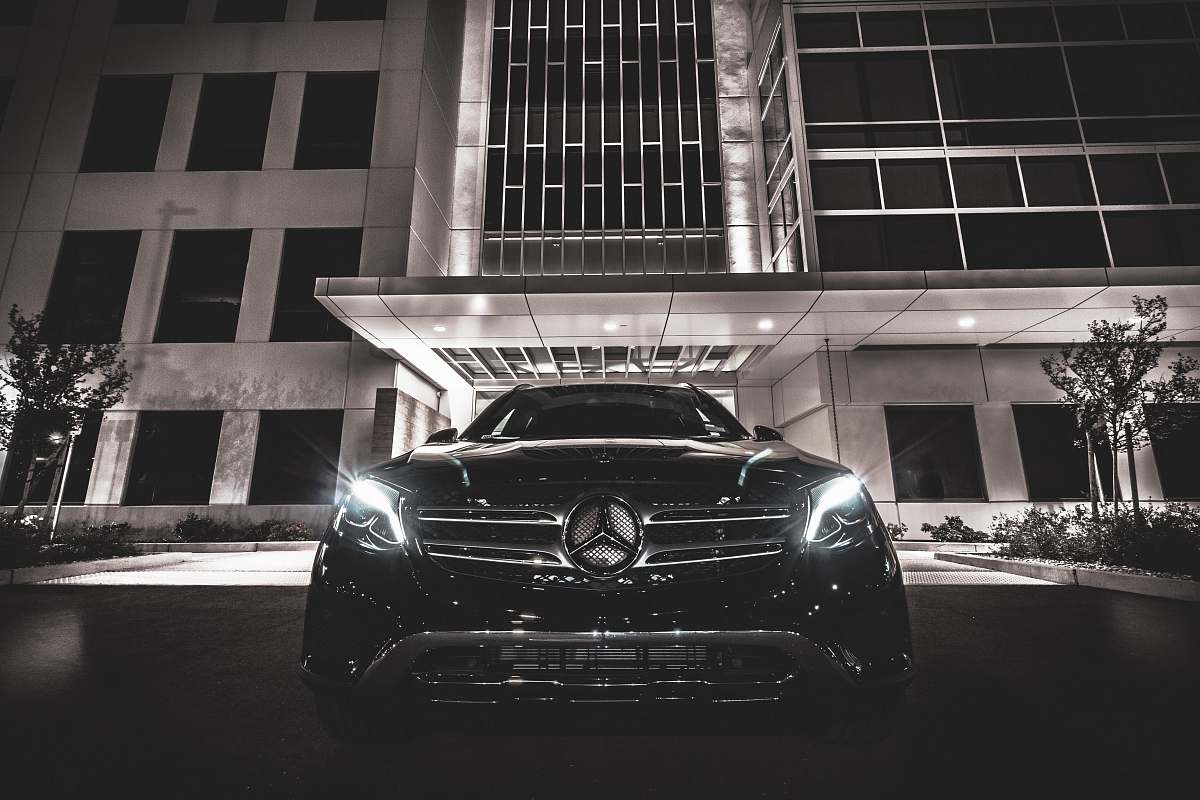 automobile black Mercedes-Benz near building vehicle