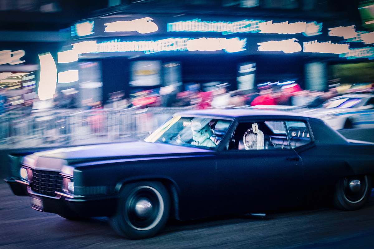 transportation panning photo of purple car on road automobile