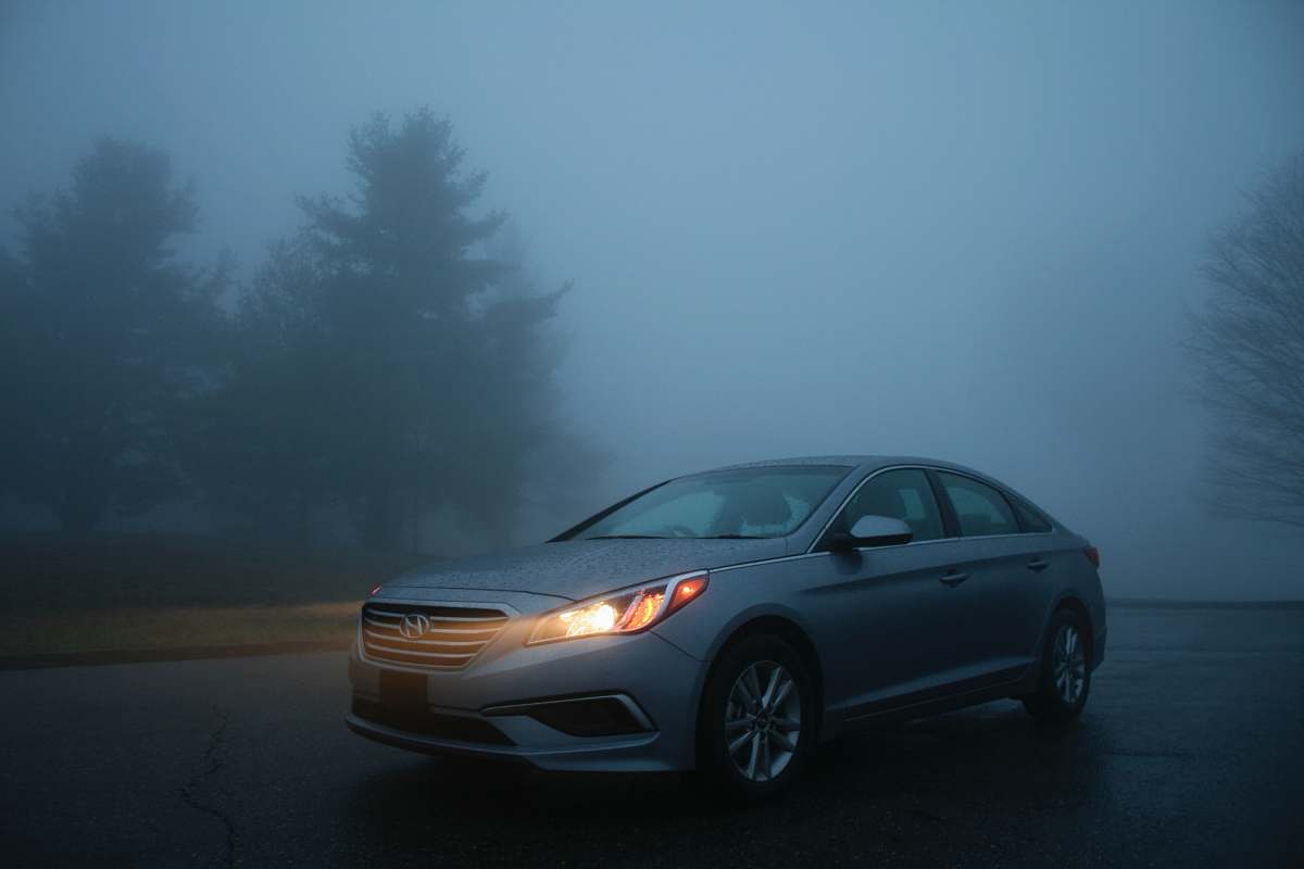 vehicle silver Hyundai sedan on gray concrete road automobile