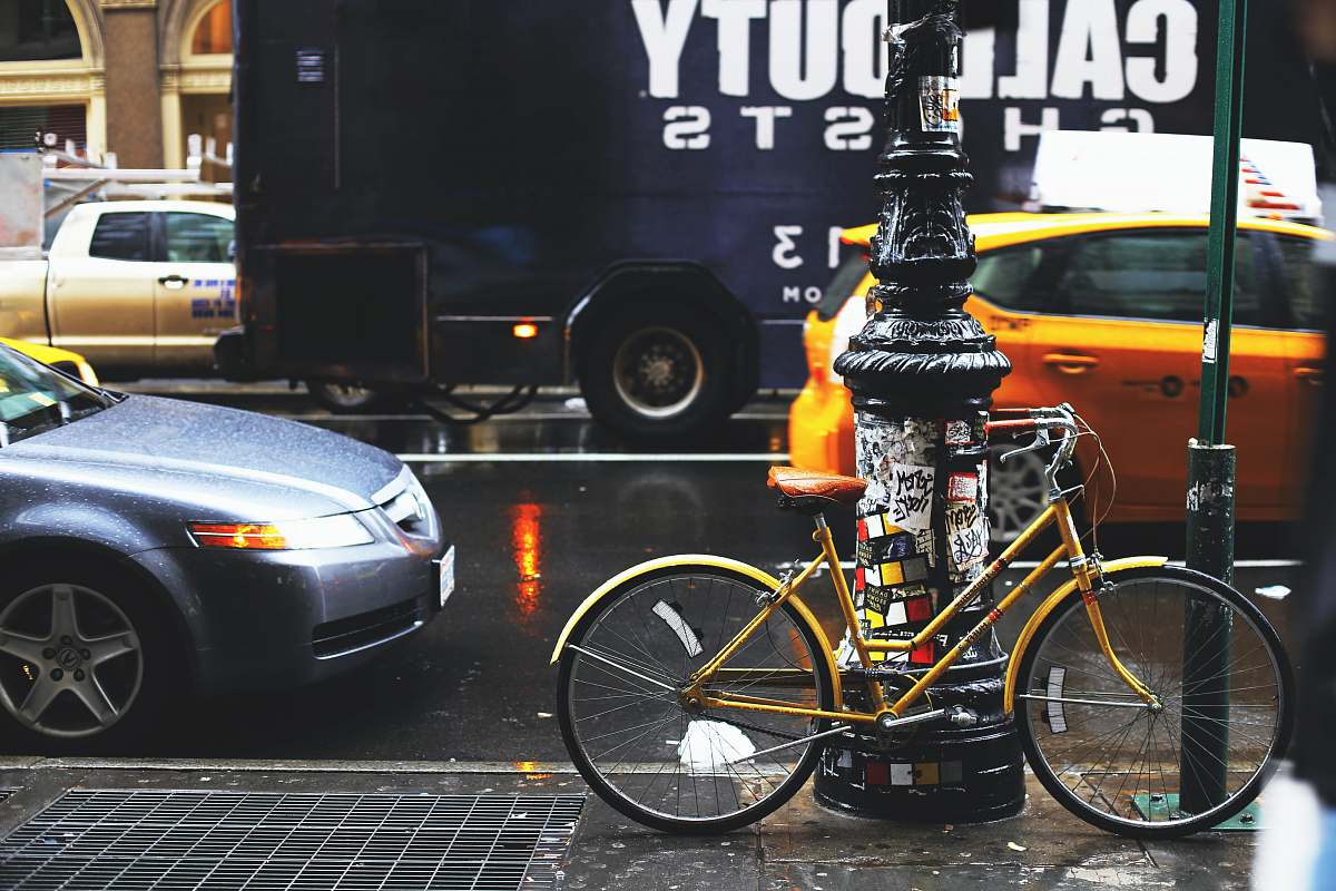 bike yellow bicycle parking near post bicycle
