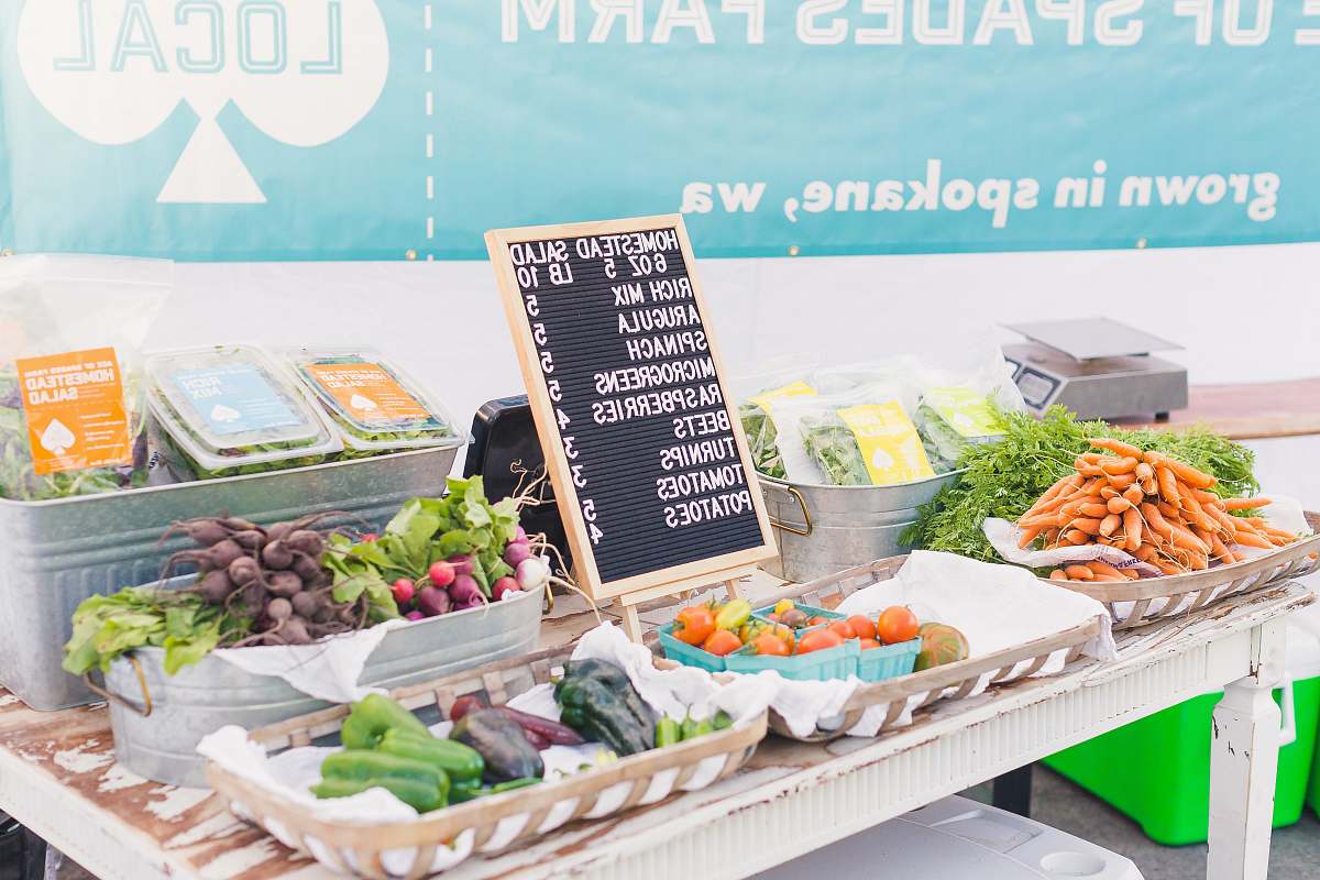 produce variety of vegetables with price sign on table flora
