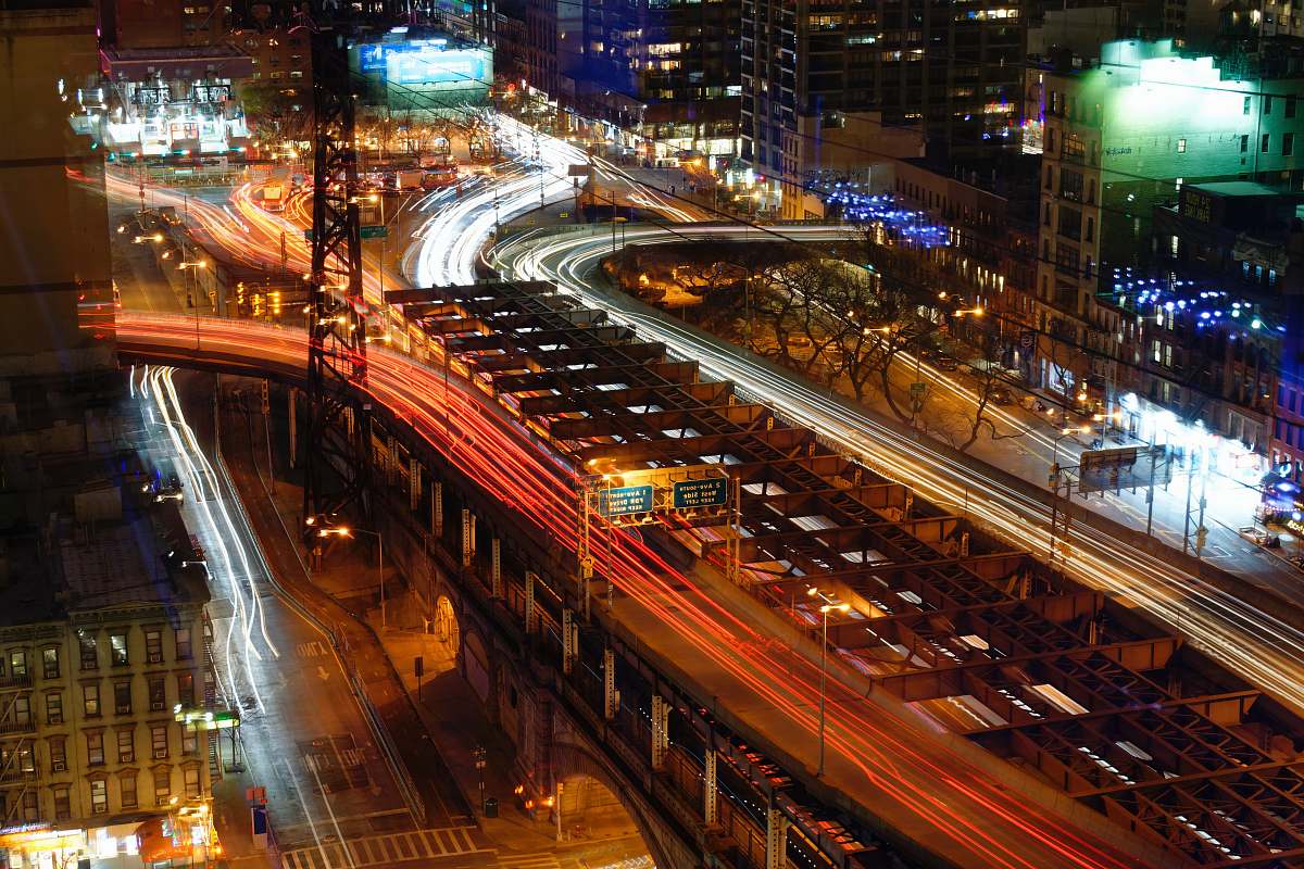 urban aerial view of roadway bridge during night time building