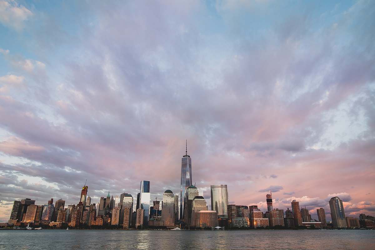 urban assorted buildings near body of water under cloudy sky new york