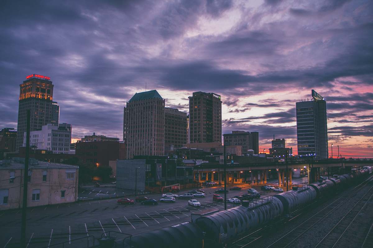urban bird's eye view photography of high-rise buildings and train station birmingham