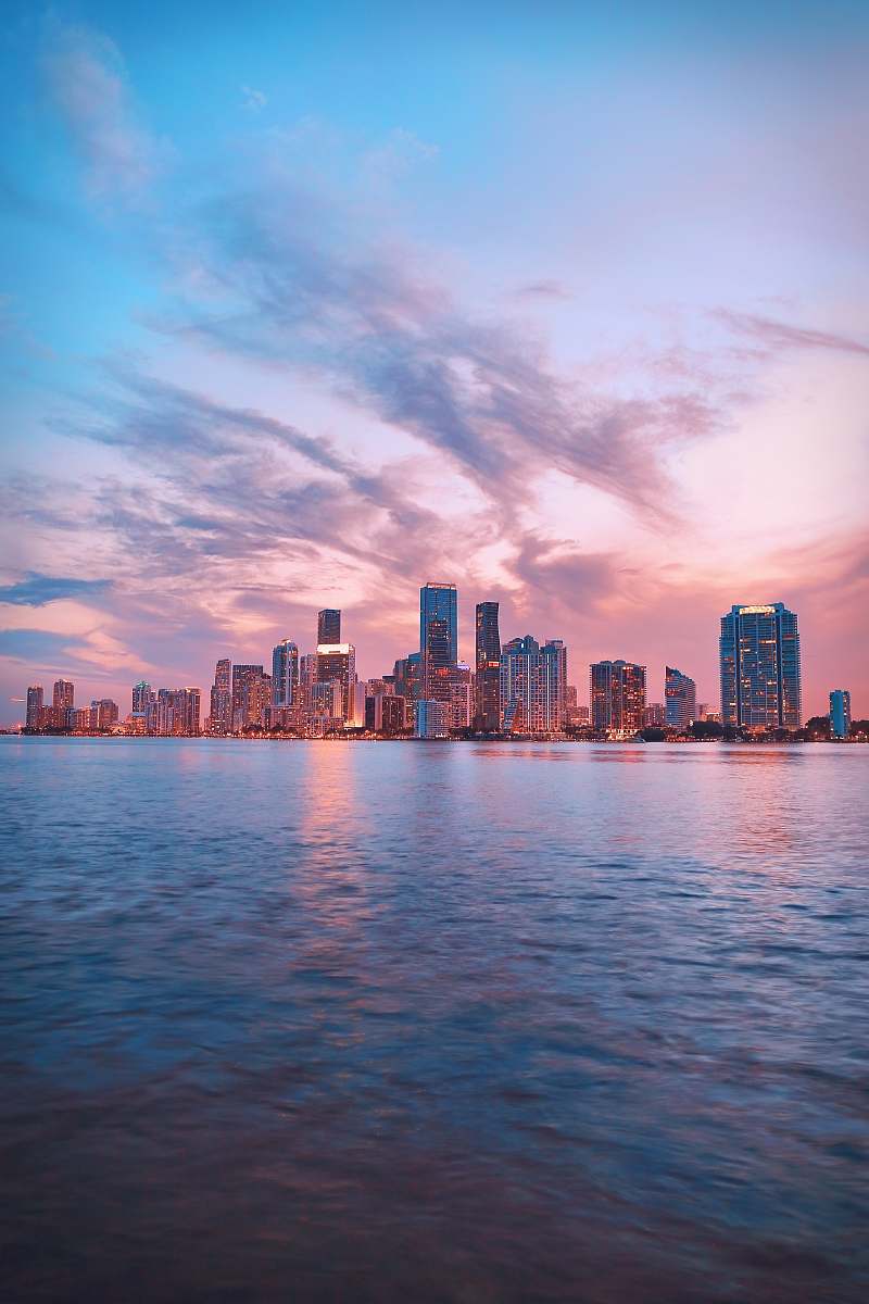 building body of water near of city high-rise buildings downtown