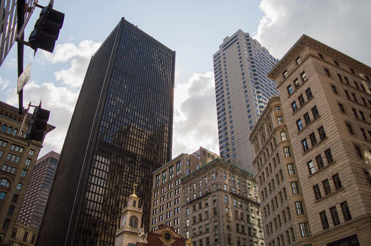 urban city with high-rise buildings under white skies downtown