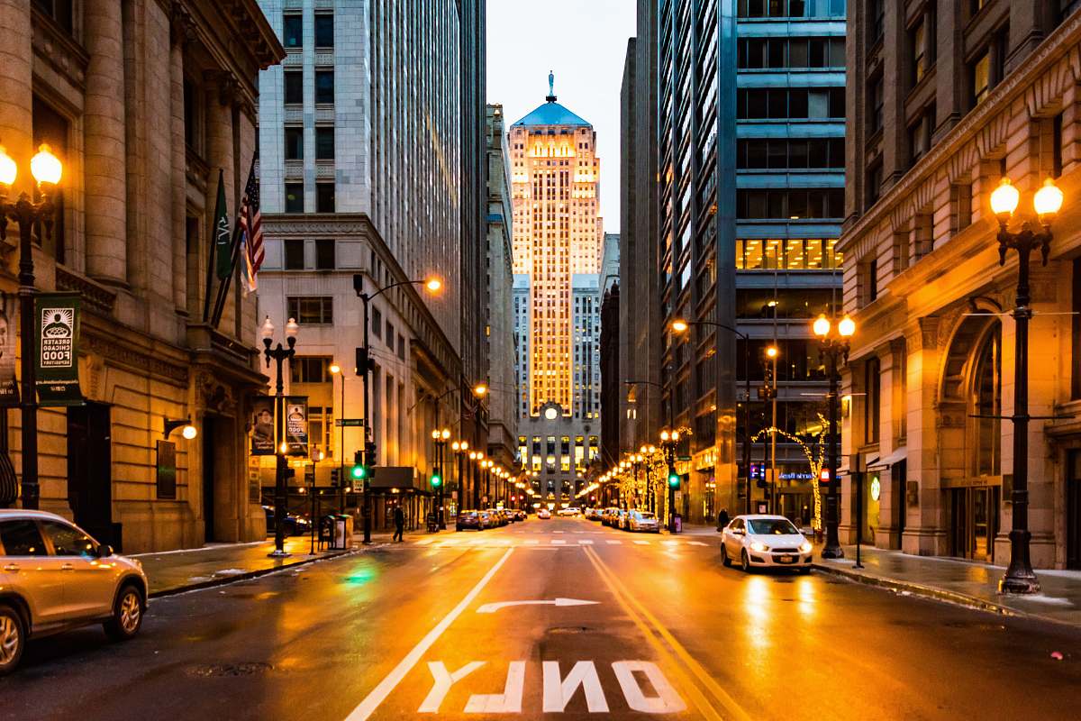 road lighted roadway surrounded with buildings street