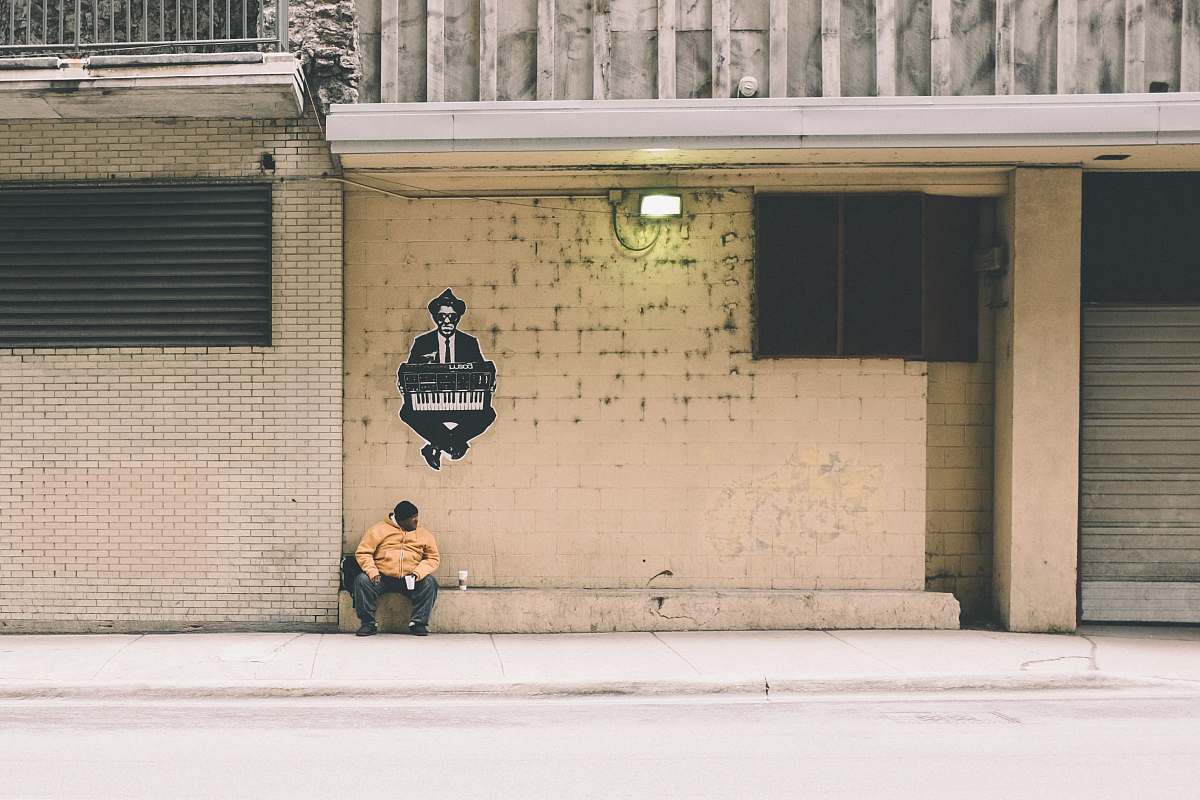 chicago person sitting on gray concrete bench united states