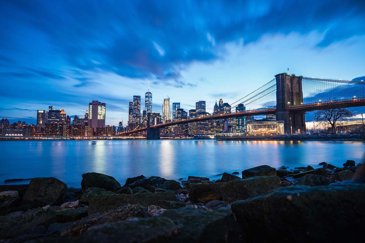 building photography of full-suspension bridge during daytime water