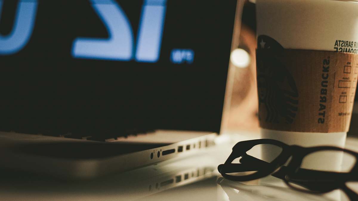 electronics eyeglasses beside laptop computer pc