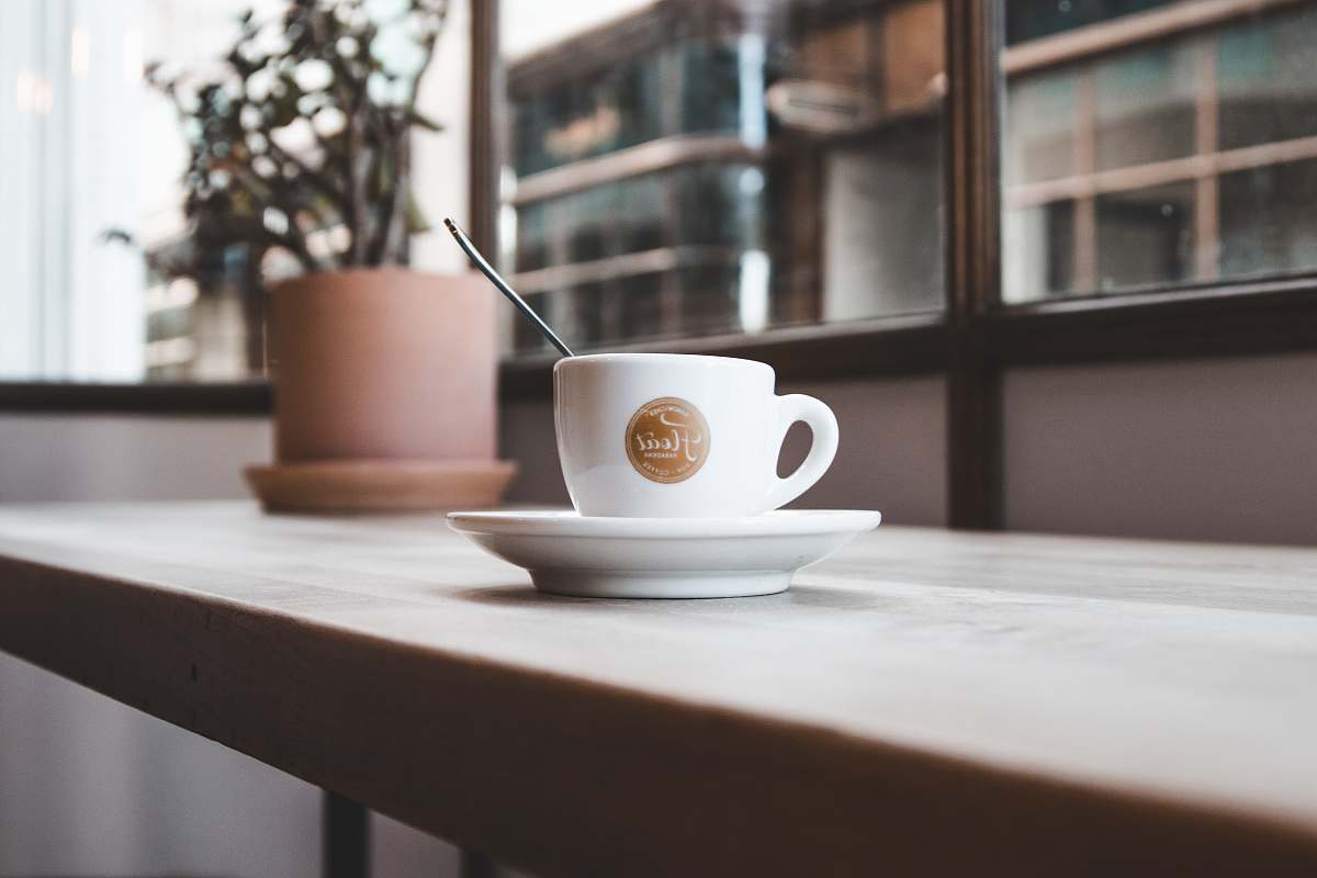 plant cup with saucer on table coffee cup