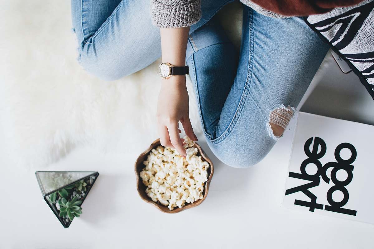 gemstone person holding popcorn on bowl jewelry