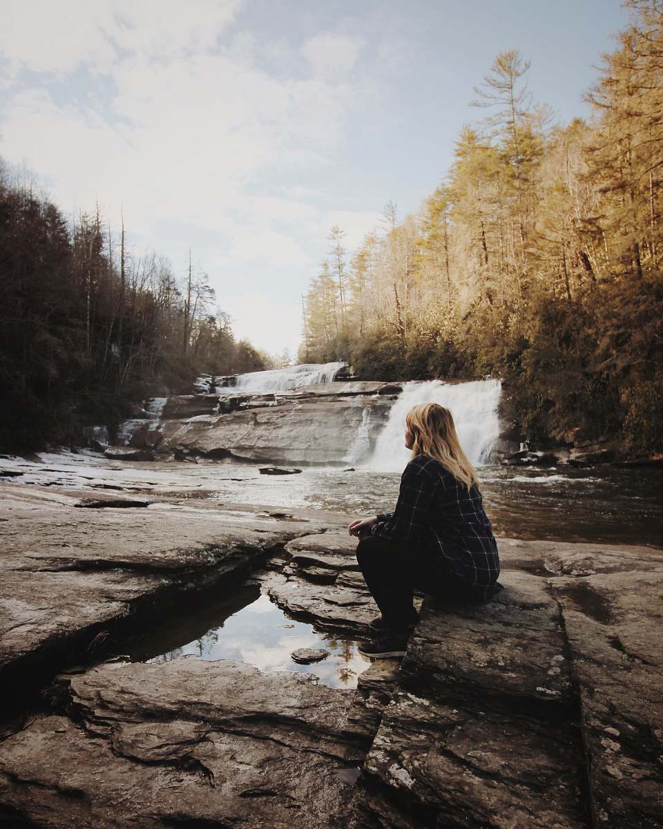 blonde woman sitting near falls girl