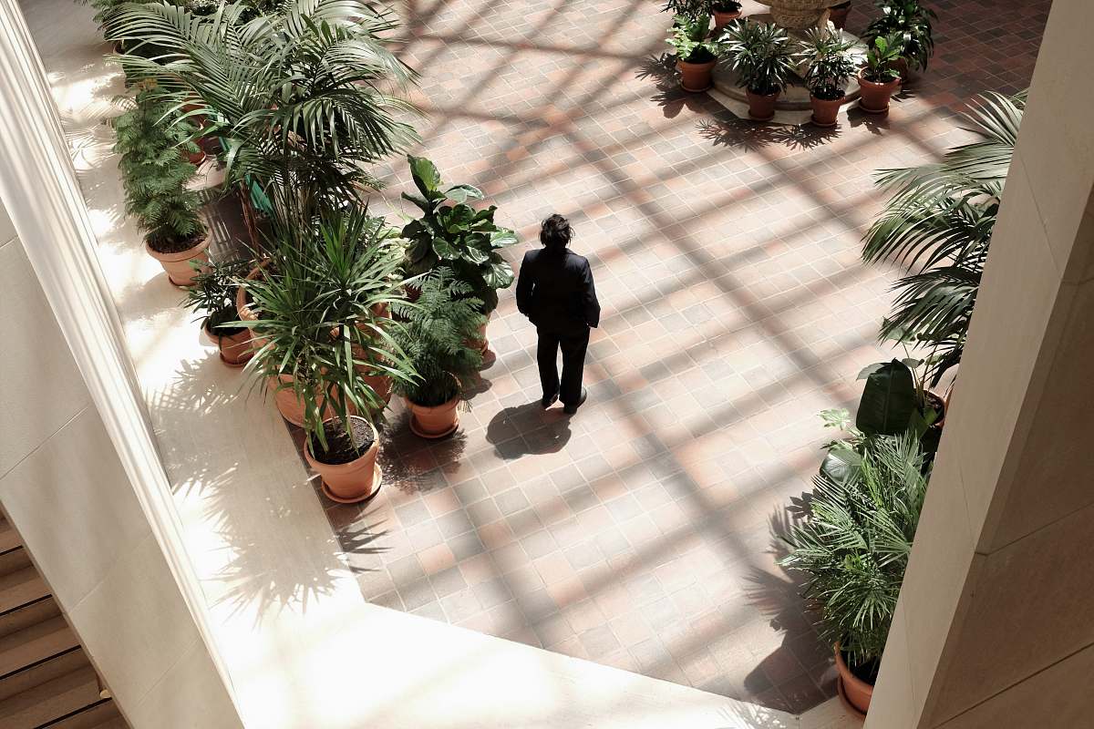 plant person standing on plants jar