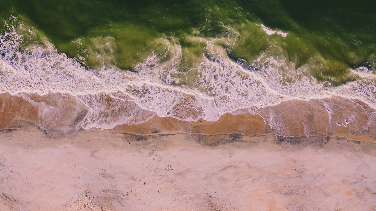 basin aerial photo of the shore and large body of water sand