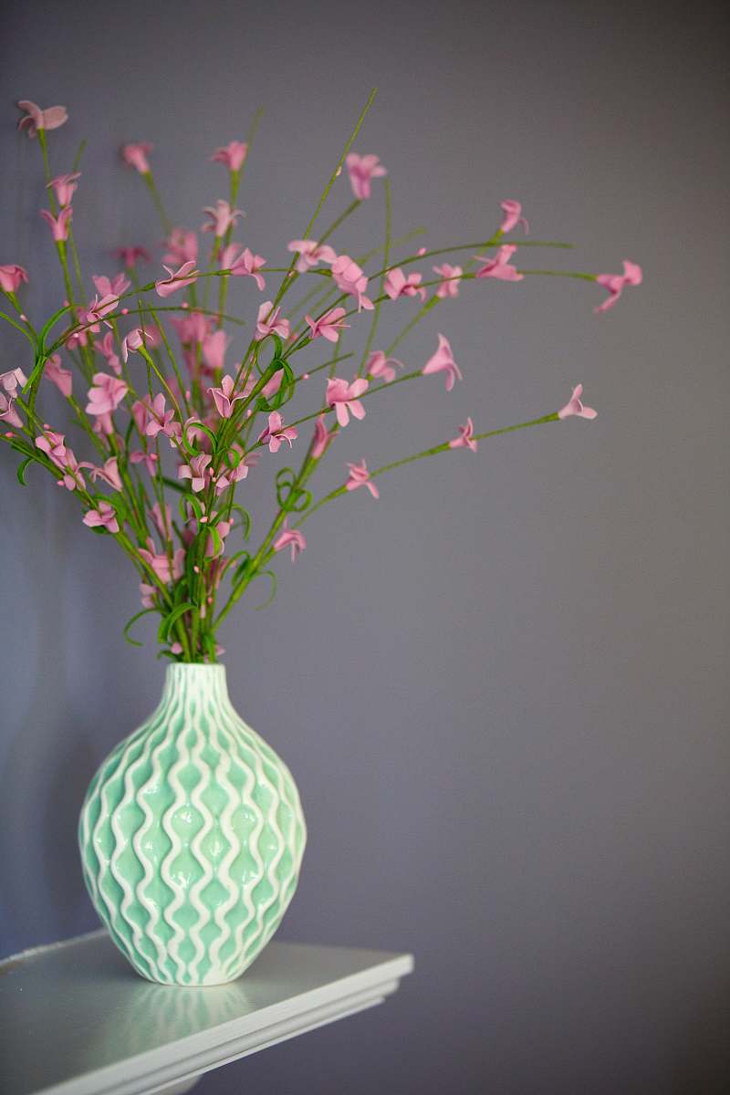 blossom pink petaled flowers on green vase vase