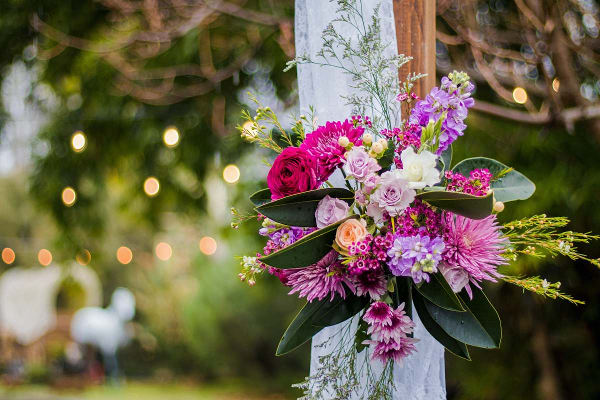 wedding shallow focus photo of pink and purple flowers flower bouquet