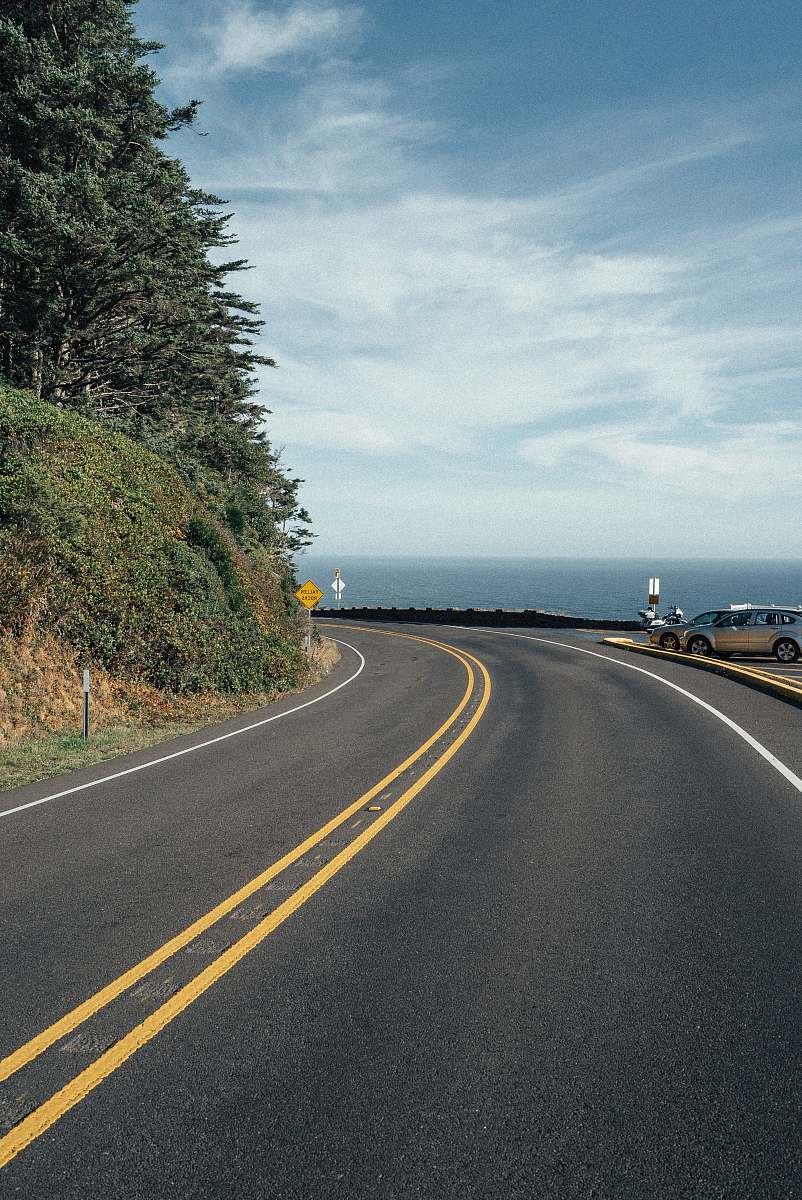 road gray coupe near road highway