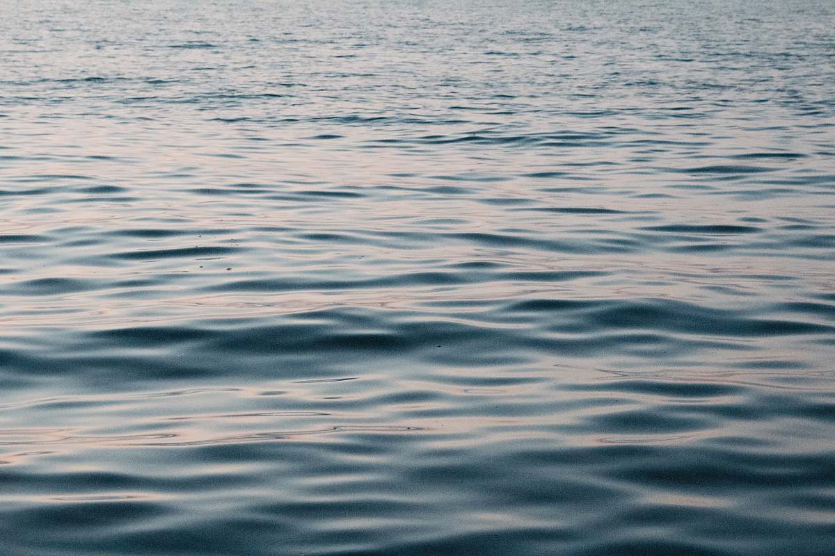 water body of water during daytime ripple