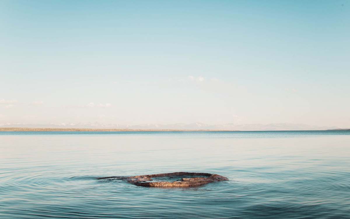 water body of water under blue sky at daytime sea