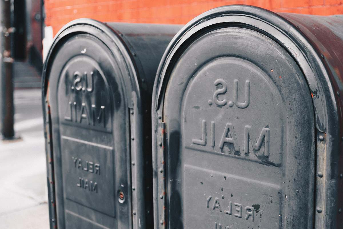 mailman close view of two gray U.S mailboxes philadelphia
