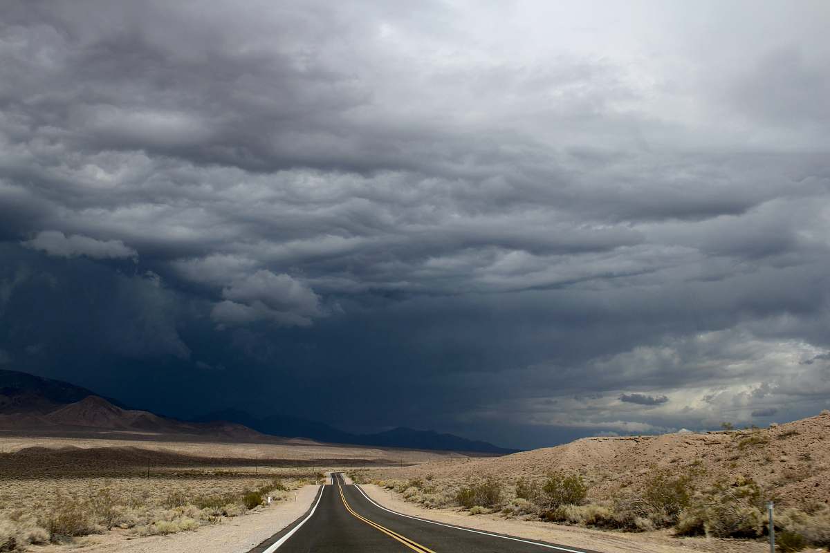road gray asphalt road under blue sky during daytime cloud