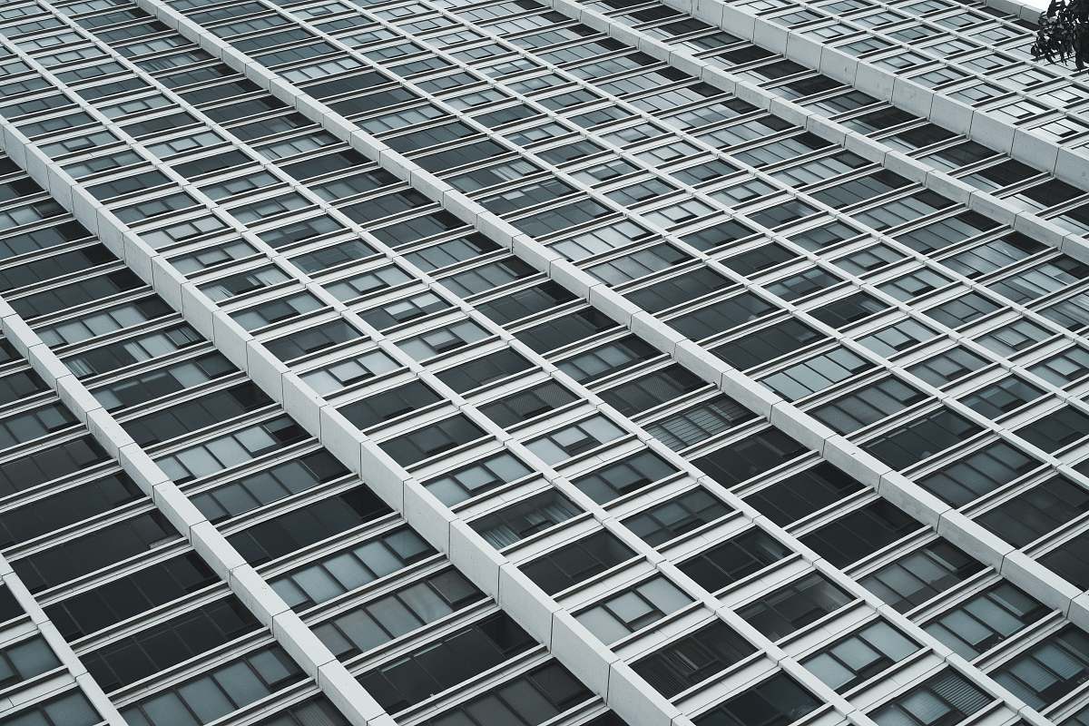 building low-angle photography of white and black high rise building city