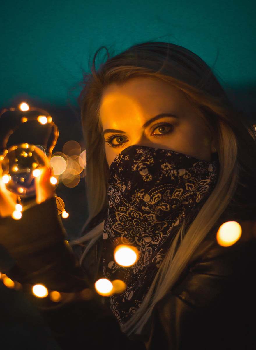 people bokeh woman near string light person