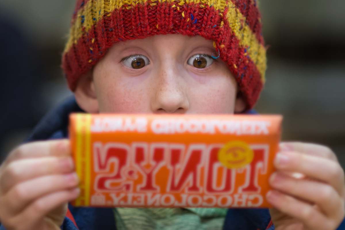 person boy holding Tony's chocoloney pack people